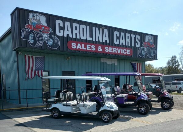 Front exterior of Jimmy’s Carolina Carts dealership with multiple golf carts displayed outside in Florence, South Carolina